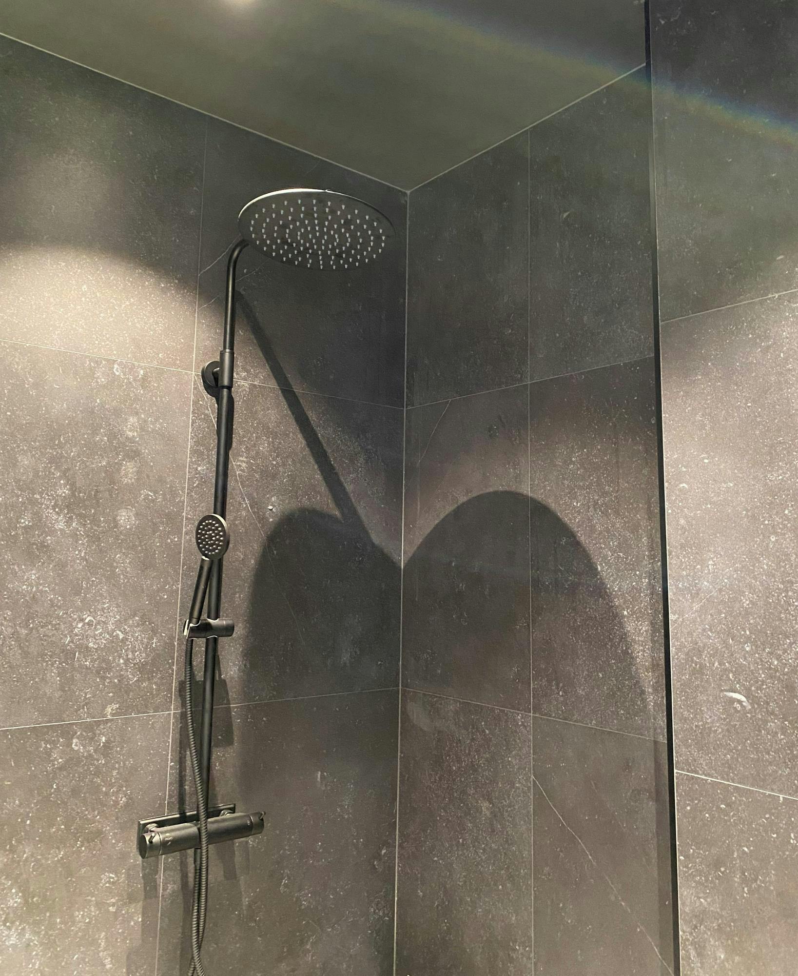 Image 52 of Villa Zero Dekton Fossil wall cladding shower1.jpg?auto=format%2Ccompress&ixlib=php 3.3 in Sustainable washbasins in Mediterranean colours and modern design for the groundbreaking Superloo bathrooms - Cosentino