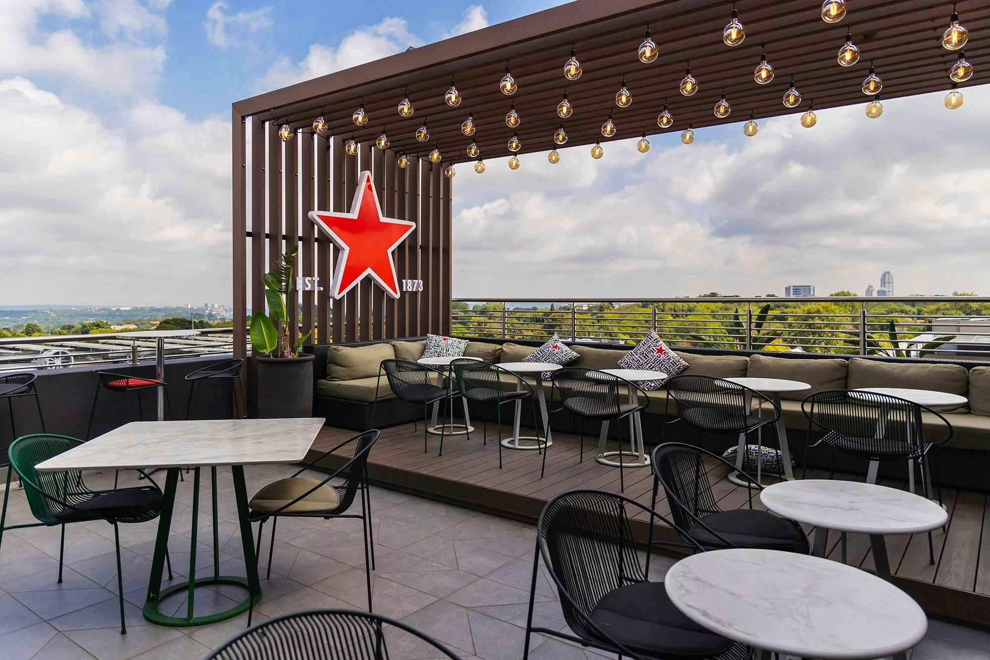 Image 32 of Radisson RED 132.jpg?auto=format%2Ccompress&ixlib=php 3.3 in A bold rooftop bar in the heart of Rosebank enhanced by Dekton surfaces - Cosentino
