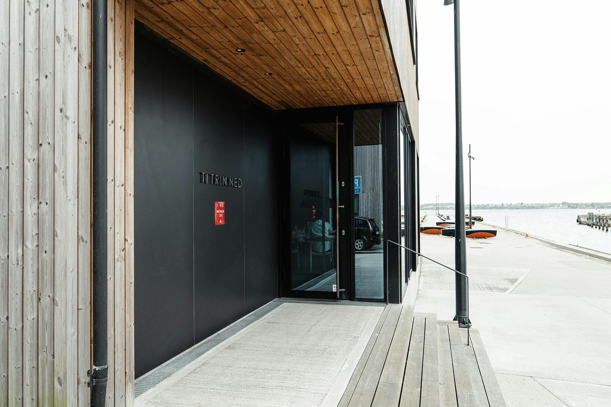 Image of Ti Trin Ned New Entrance 1 2.jpg?auto=format%2Ccompress&ixlib=php 3.3 in {{This Michelin-starred Danish restaurant uses Dekton on its façade to withstand the harsh marine environment }} - Cosentino