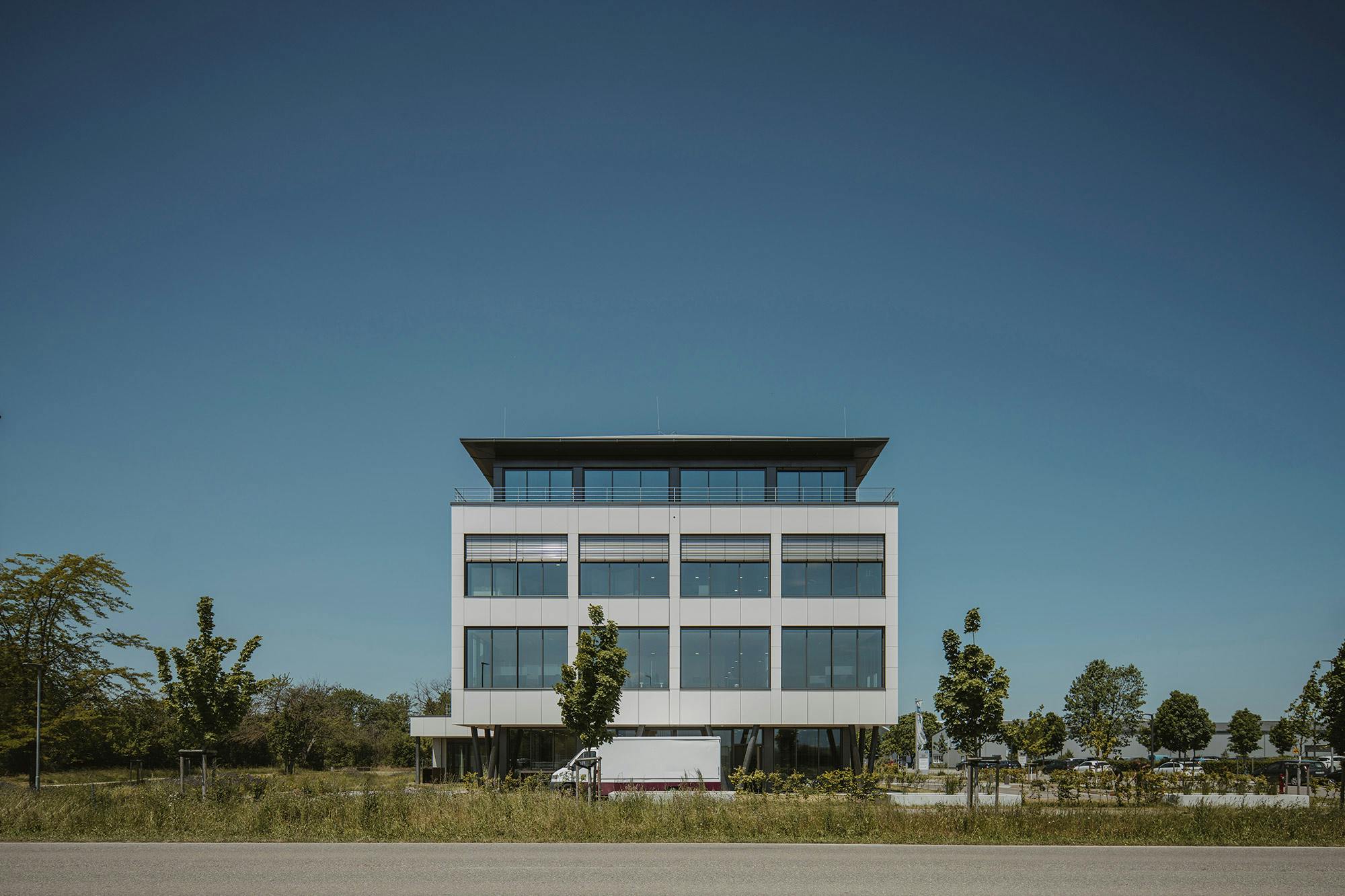Image of Volksbank Eschbach Facade 22.jpg?auto=format%2Ccompress&ixlib=php 3.3 in Only two façade elements (recessed windows and slanted Dekton panels) create variety  - Cosentino