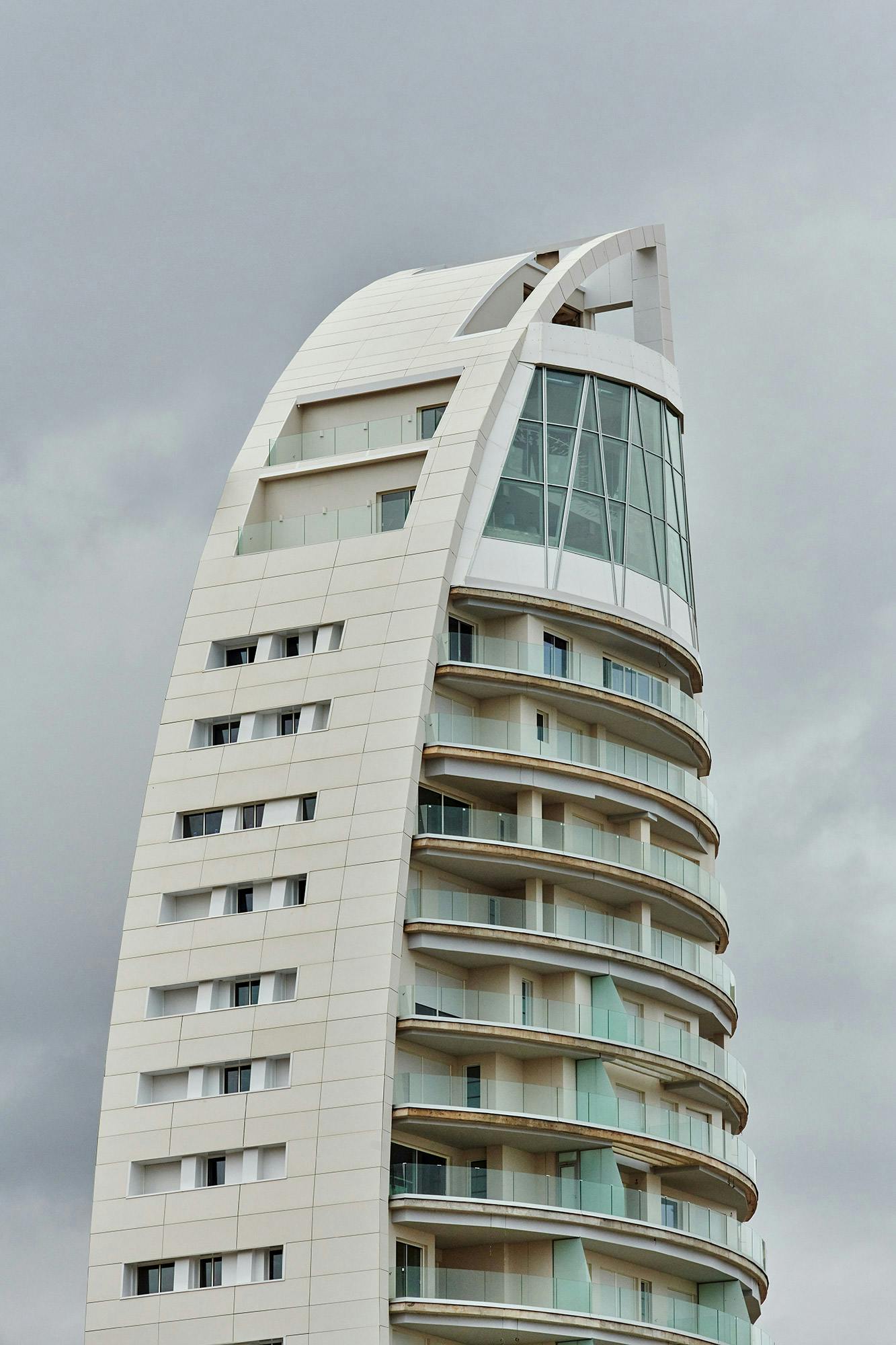 Image of delfin tower benidorm 10.jpg?auto=format%2Ccompress&ixlib=php 3.3 in Dekton presents the world’s first curved and ventilated façade made of ultra-compact stone - Cosentino