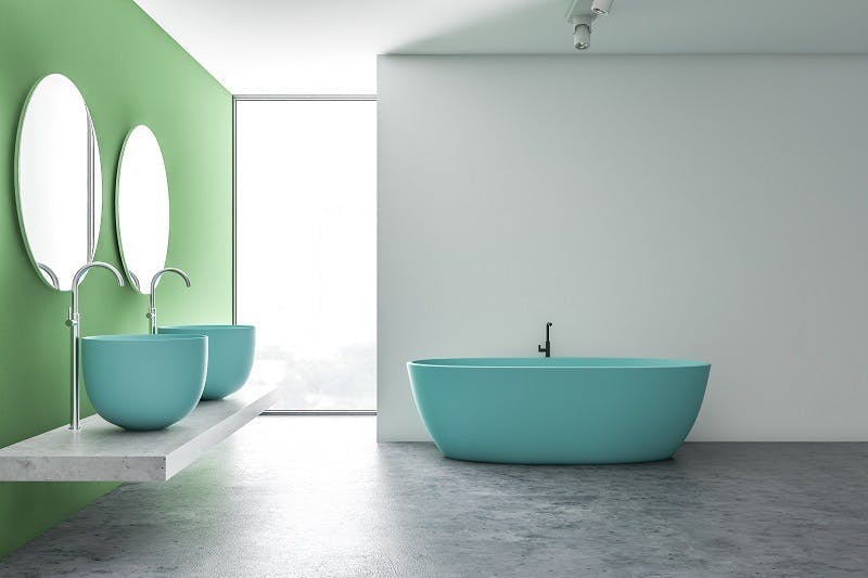 Baño verde con bañera azul