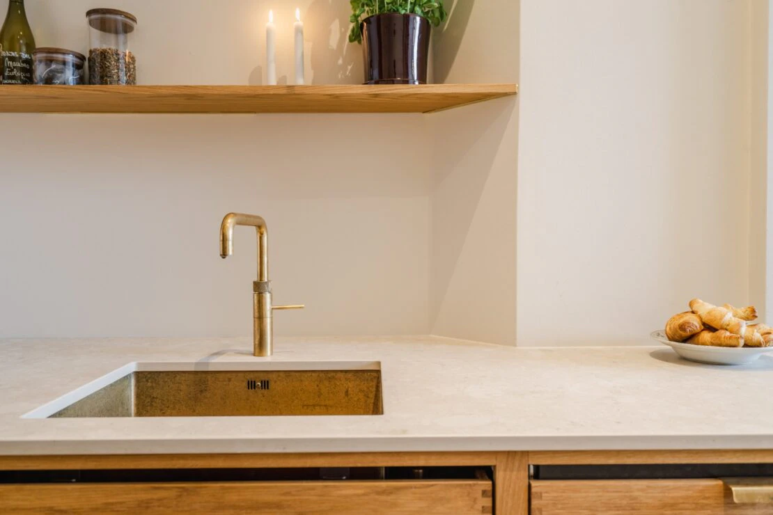 A modern, practical and discreet kitchen in a historic building in