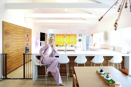 Image 41 of 6. coco rocha kitchen overall with coco 2.jpg?auto=format%2Ccompress&fit=crop&ixlib=php 3.3 in Kim Lewis Tiny Home with Silestone Eternal Statuario kitchen countertops - Cosentino