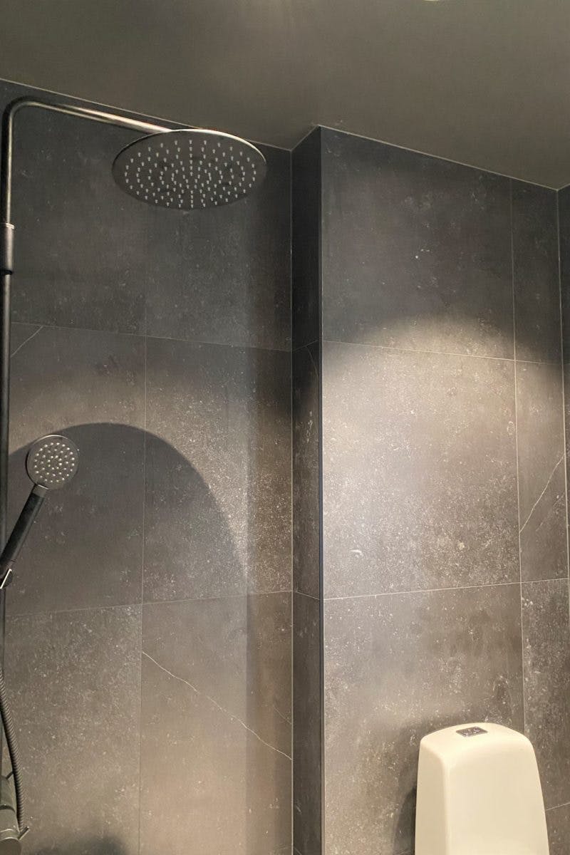 Villa Zero Dekton Fossil wall cladding shower