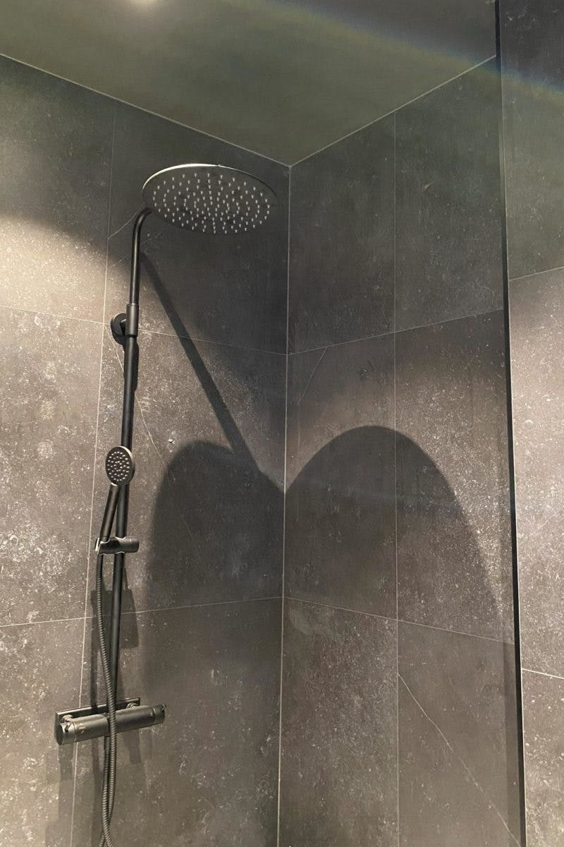 Villa Zero Dekton Fossil wall cladding shower1